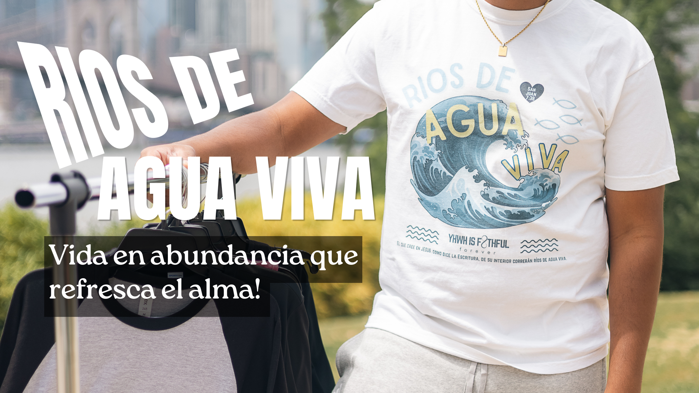 Person wearing a t-shirt with 'Rios de Agua Viva' design outdoors